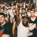 People cheering in a crowd