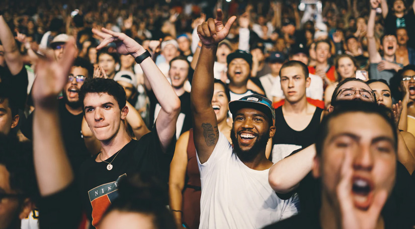 People cheering in a crowd