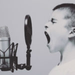 A kid shouting into a mic