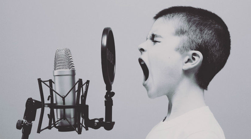 A kid shouting into a mic
